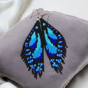 Butterfly Wings patterned beaded tassel earrings. New.